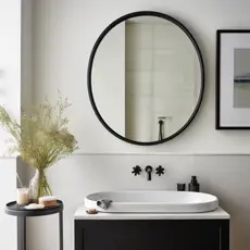 black framed illuminated bathroom mirror
